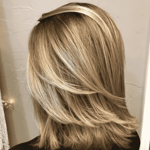 Shoulder-length layered haircut for straight hair, a trending 2025 style offering volume, softness, and movement.