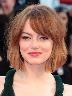Emma Stone with a short textured bob haircut, showcasing one of the top celebrity short hairstyles for 2025.