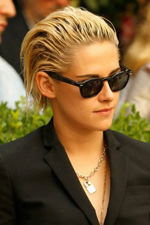 Kristen Stewart with a slicked-back crop hairstyle, showcasing one of 2025’s edgiest celebrity short hair trends.