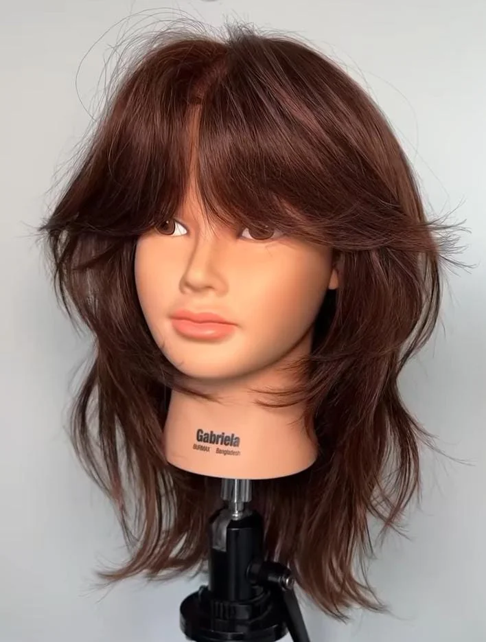 Modern straight shag haircut with mullet-inspired layers, trending in 2025 for edgy, textured straight hair in the USA.
