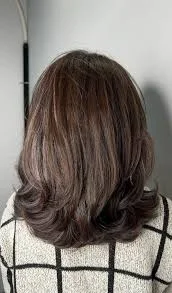 Mid length straight haircut with textured ends, a 2025 hairstyle trend for effortless volume and soft shape in the USA.