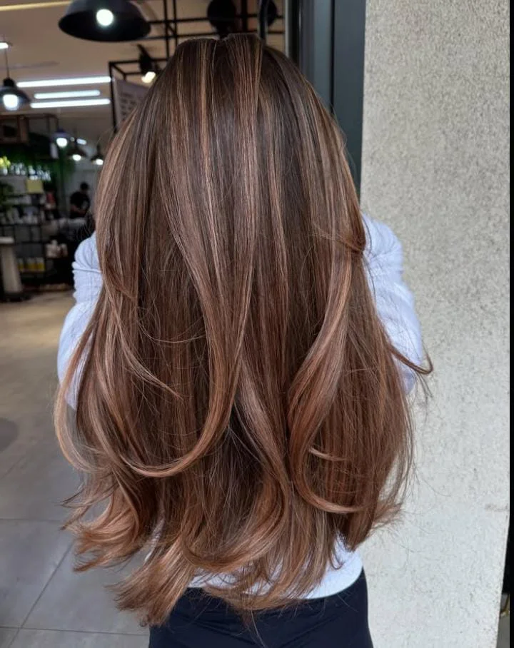 Ultra long sleek straight hairstyle with shadow root, a trending 2025 look combining glam length with effortless color depth.