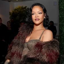 Rihanna-inspired curly pixie cut, a revived celebrity short hairstyle trending in 2025 for natural texture and bold style.
